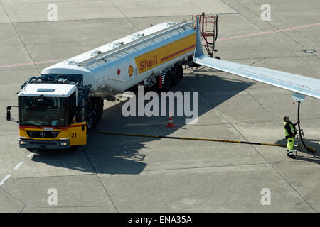 Shell aviation fuel tanker refuelling aircraft at Dusseldorf airport Germany Stock Photo
