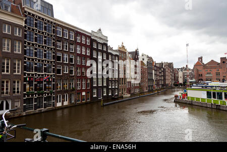 The iconic Dancing Houses alongside a canal dock  in Amsterdam Stock Photo