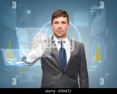 attractive buisnessman wotking with virtual screen Stock Photo
