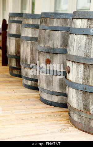 Pickle barrels on the front porch of a colonial era mercantile. Stock Photo