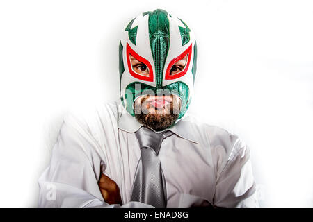job, aggressive businessman with Mexican warrior mask Stock Photo