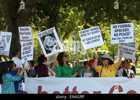 San Francisco, California, USA. 30th Apr, 2015. Protesters from Chinese community are seen in a demonstration against visiting Japanese Prime Minister Shinzo Abe in Stanford University, California, the United States, on April 30, 2015. Over one hundred Chinese and Korean Americans gathered outside Stanford Unviersity's Bing Concert Hall and urged visiting Japanese Prime Minister Shinzo Abe to stop distorting history when he arrived there for a speech on campus. Credit:  Xinhua/Alamy Live News Stock Photo