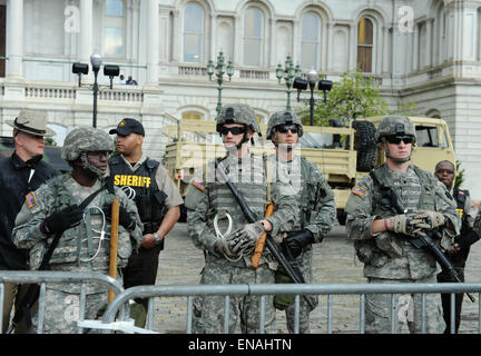 Baltimore, USA. 30th Apr, 2015. National Guards and police officers stand in front of City Hall to watch a rally protesting the death of Freddy Gray in front of City Hall in Baltimore, Maryland, the United States, April 30, 2015. Credit:  Bao Dandan/Xinhua/Alamy Live News Stock Photo