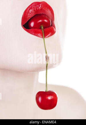 Beauty concept woman with cherry in her mouth. Studio shooting. Summer time and theme. Close up shooting. Beauty fashion concept Stock Photo