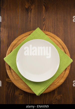 plate, knife and fork  on wooden background Stock Photo