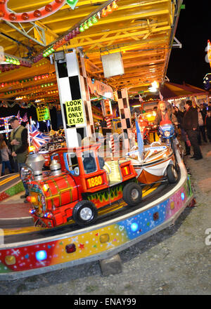 All the fun of the fair with Fair Ground Images making Patterns in lights at Night Stock Photo