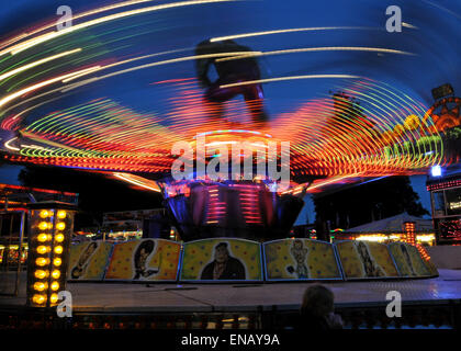 All the fun of the fair with Fair Ground Images making Patterns in lights at Night Stock Photo