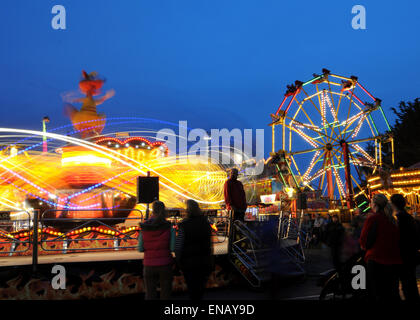 All the fun of the fair with Fair Ground Images making Patterns in lights at Night Stock Photo