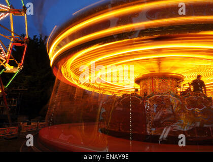 All the fun of the fair with Fair Ground Images making Patterns in lights at Night Stock Photo