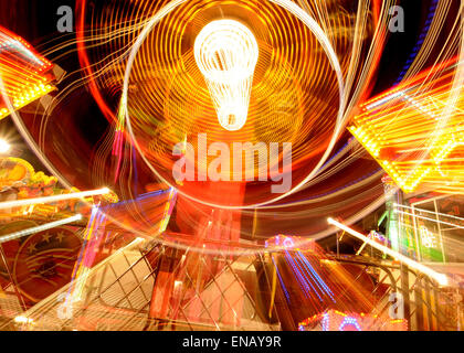 All the fun of the fair with Fair Ground Images making Patterns in lights at Night Stock Photo