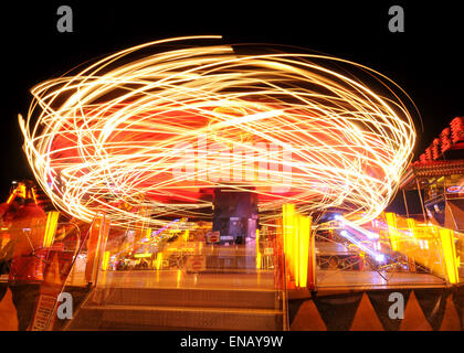 All the fun of the fair with Fair Ground Images making Patterns in lights at Night Stock Photo