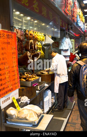 dh Market shop CAUSEWAY BAY HONG KONG Stall owner chopping cooked meat pavement shop meats street asian food Stock Photo