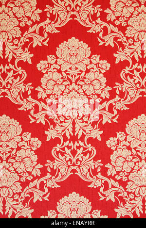 elegant baroque wallpaper, red with golden rose design, closeup Stock Photo