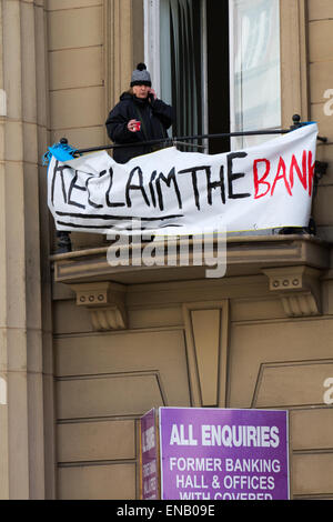 Liverpool, Merseyside, 1st May, 2015. 'All enquiries' & 'Reclaim the Bank' Sale Signs where Homeless Demonstrators occupying old Bank of England Building in Castle Street. In new tactics today Merseyside Police issued Dispersion Orders to sympathisers providing food and water to the occupiers of the unoccupied old Bank. The so called Love Activists are resisting a planned eviction from a historic former Liverpool city centre building which they occupied and turned into an illegal homeless shelter.  Credit:  Mar Photographics/Alamy Live News Stock Photo