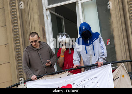 Liverpool, Merseyside, 1st May, 2015. Masked & Disguised Homeless demonstrators.  Love Activists occupying Liverpool bank building in Castle Street vow to lock themselves in the vault if bailiffs try to evict them. In new tactics today Merseyside Police issue Dispersion Orders to sympathisers providing food and water to the occupiers of the old Bank. Love Activists are resisting a planned eviction from a historic former Liverpool city centre building which they turned into an illegal homeless shelter.  Credit:  Mar Photographics/Alamy Live News Stock Photo