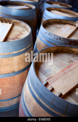 Close up of oak barrels in a French winery Stock Photo