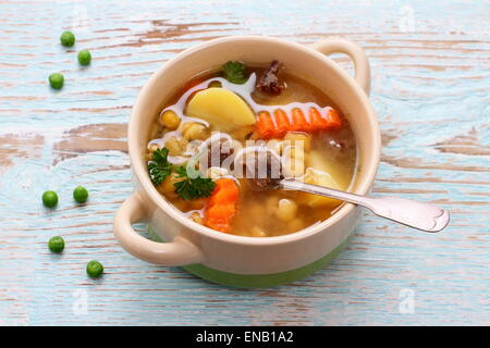 Yellow pea soup, stew meat and potato, close up Stock Photo
