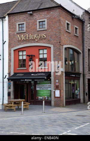 Ireland, North, Belfast, Exterior of McHughs bar in Queens Square. Stock Photo