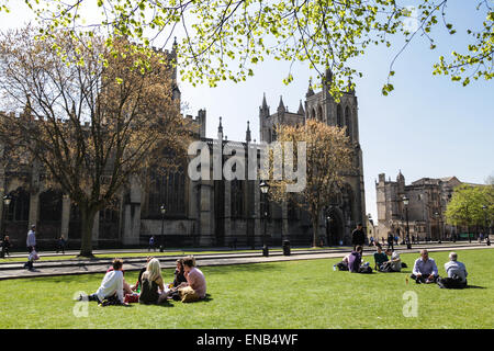 People enjoying their lunch next to Bristol Cathedral on College Green Stock Photo