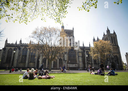 People enjoying their lunch next to Bristol Cathedral on College Green Stock Photo