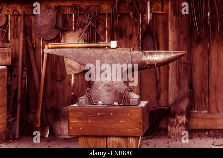 Anvil and hammer in blacksmith workshop, Log Cabin Village, Fort Worth, Texas Stock Photo