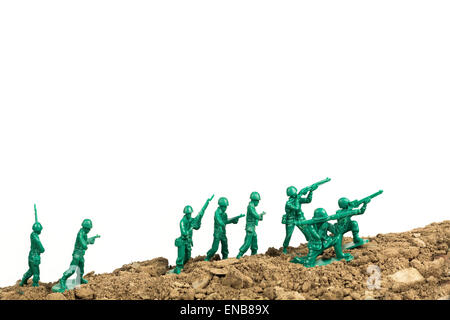 Toy soldiers march along the horizon in war image Stock Photo