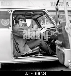 Manchester United footballer George Best, whose six-month driving ban has just ended, drove to training 'under his own steam.' During the suspension he has been driven by a chauffeur. 28th January 1969. Stock Photo