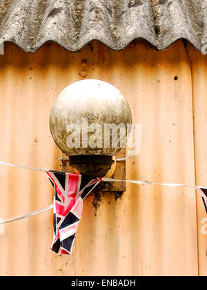 Tired bunting on an old shed beside the Staffordshire and Worcestershire Canal at Compton. Stock Photo