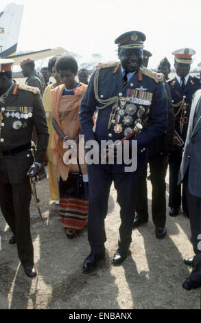 President of Uganda, General Idi Amin, pictured in military uniform attending a military parade, accompanied by his wife. Circa 1979. Stock Photo