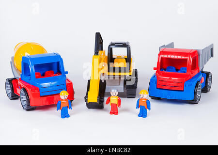 Miniatures of construction workers and trucks Stock Photo