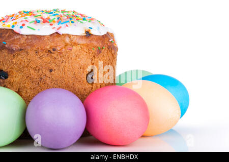 Easter cake and painted eggs closeup on white background Stock Photo