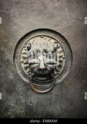 Antique door knocker in the form of a lion's head on old metal door of Lutheran Church St. Lorenz, Nuremberg Stock Photo