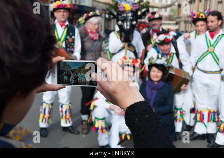 Oxford, Oxfordshire, UK. 1st May, 2015. Asian tourists take photographs with morris dancers during the celebrations of May Morning in Oxford, England Credit:  Stanislav Halcin/Alamy Live News Stock Photo