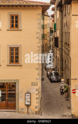 Tight parking on narrow street in Arezzo, Italy Stock Photo