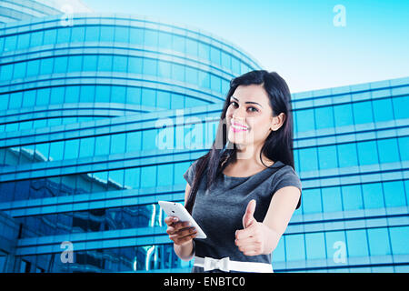 1 indian Business woman phone Thumbs Up showing Stock Photo