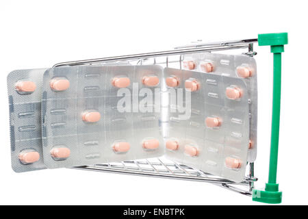 Shop cart with pills blisters on an white background Stock Photo