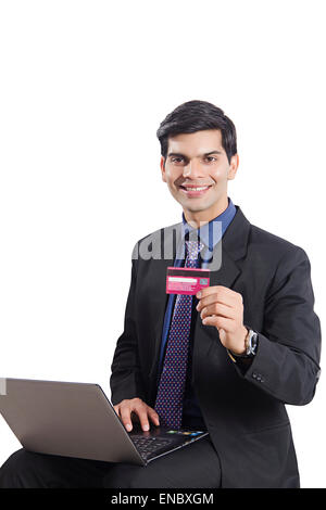 1 indian Business Man laptop Credit Card shopping Stock Photo