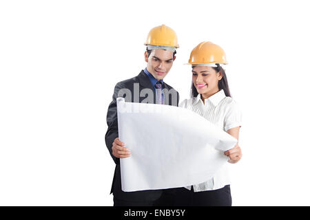 2 indian Engineer Colleague map Checking Stock Photo