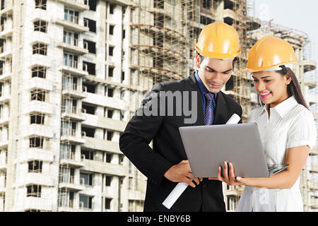 2 indian Engineer Colleague Concentration site Project Laptop Checking Stock Photo
