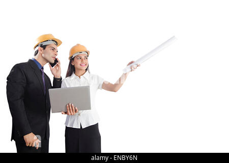 2 indian Engineer Colleague Project Laptop Checking and talking phone Stock Photo