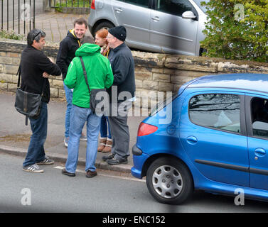 Manchester  UK  2nd May 2015 Lib Dem Parliamentary Candidate, John Leech, wearing a green cagoule, briefs his supporters as they meet in a Didsbury street before delivering leaflets to houses in the area. John won in 2005 and 2010, but Labour is expected to run them very close this time. The Conservatives are considered to have no chance.  General Election  Campaigning for LbDem in Manchester Withington Credit:  John Fryer/Alamy Live News Stock Photo