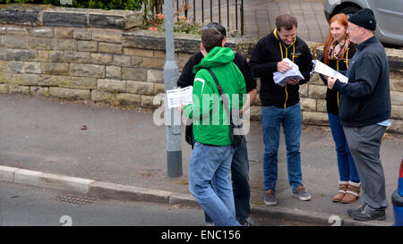 Manchester  UK  2nd May 2015 Lib Dem Parliamentary Candidate, John Leech, wearing a green cagoule, briefs his supporters as they meet in a Didsbury street before delivering leaflets to houses in the area. John won in 2005 and 2010, but Labour is expected to run them very close this time. The Conservatives are considered to have no chance.  General Election  Campaigning for LbDem in Manchester Withington Credit:  John Fryer/Alamy Live News Stock Photo