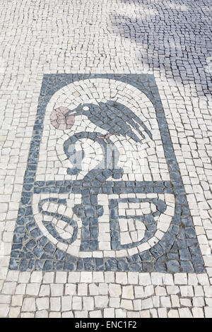 Brotherhood of Sao Bento da Porta Aberta Sanctuary symbol drawn in typical Portuguese cobblestone pavement with Saint Benedict iconography. Portugal Stock Photo