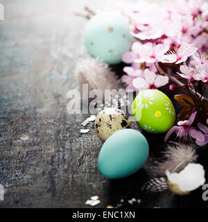 Easter composition with painted eggs and Cherry Blossom branches Stock Photo