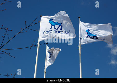 The Novo Nordisk corporate flags at the headquarters in Bagsvaerd (Bagsværd), Copenhagen, Denmark. Stock Photo