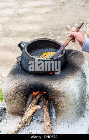 coffee pot boiling over an open fire cowboy flame smoke caffine wild west  Stock Photo - Alamy