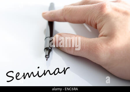 Pen in the hand isolated over white background seminar concept Stock Photo