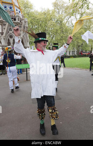 Westminster, London, UK. 2 May 2015. Morris dancers perform in Victoria Tower Gardens. Westminster Day of Dance. Nine Morris Mens' dancing groups gathered in Westminster and performed dances culminating in a massed performance in Trafalgar Square. Credit:  OnTheRoad/Alamy Live News Stock Photo