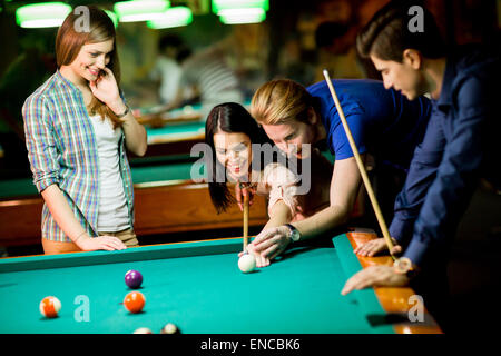 Young people playing pool Stock Photo