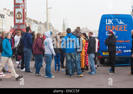 Weymouth, Dorset, UK. 2nd May, 2015. 2 May 2015. Bungee jump for charity near the Clock Tower at Weymouth - jumpers queue and wait for the wind to drop. Credit:  Carolyn Jenkins/Alamy Live News Stock Photo